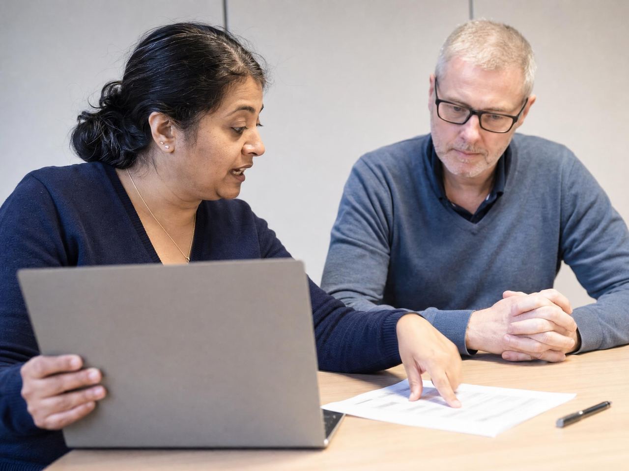 Compliance and IT leads working through a supplier security review together